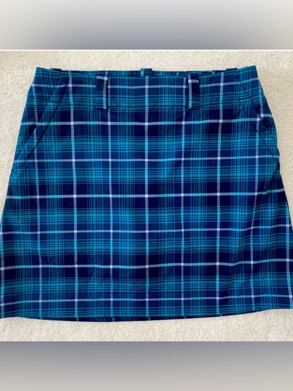 Nike Dri-Fit teal/navy blue/white plaid golf skort, size 6. Excellent condition.